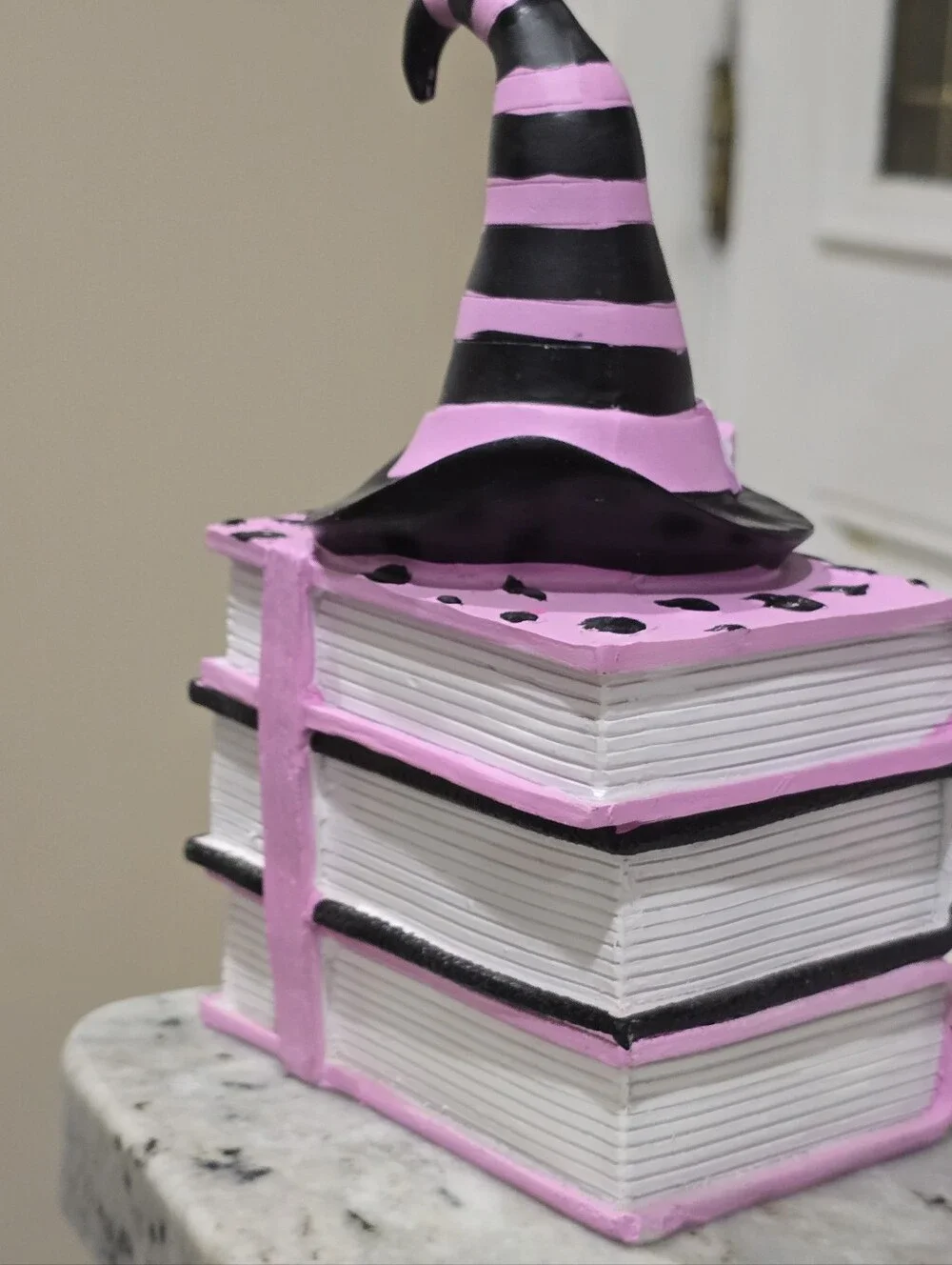 Summerween Pink & Black Witches Hat on Stack of Spell Books Halloween